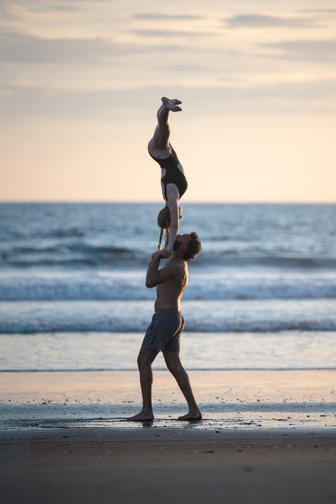 Standing hand to hand on the beach